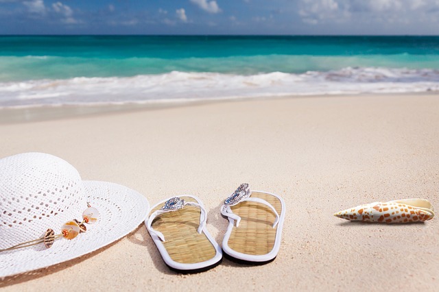 beach flipflops and white hat