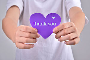 bigstock Children holding thank you heart purple