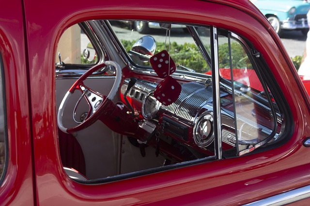 dice in classic red car