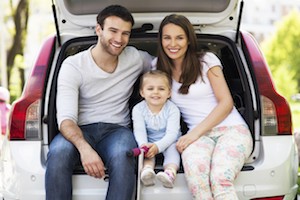 family in back of car